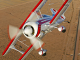 A Pitts Model 12 Biplane in Flight Photographic Print by  Stocktrek Images