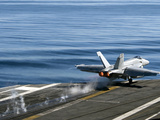 An F/A-18E Super Hornet Launches from the Flight Deck of USS Carl Vinson Photographic Print by  Stocktrek Images