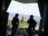 A Box of Humanitarian Goods Travels to the Yap Islands During Operation Christmas Drop Photographic Print by  Stocktrek Images