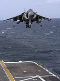 An AV-8B Harrier II Prepares to Land on the Flight Deck of USS Nassau Photographic Print by  Stocktrek Images