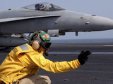 A Shooter Launches an F/A-18E Super Hornet from USS Ronald Reagan Photographic Print by  Stocktrek Images