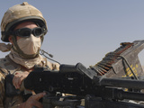 A British Army Soldier Mans a Machine Gun Mounted on Top of a Land Rover Photographic Print by  Stocktrek Images