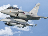 A Dassault Rafale of the French Air Force Flys Alongside a U.S. Air Force F-16C Fighting Falcon Photographic Print by  Stocktrek Images