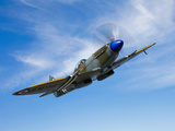A Supermarine Spitfire MK-18 in Flight Photographic Print by  Stocktrek Images
