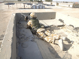 A British Soldier Provides Security from a Rooftop in Basra, Iraq Photographic Print by  Stocktrek Images