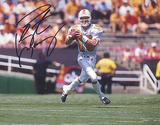 Peyton Manning Autographed Tennessee White Jersey Dropping Back Horizontal Photograph Photo
