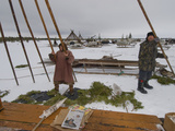 Komi Tribespeople Erect the Poles of their Reindeer-Skin Chum Photographic Print by Gordon Wiltsie