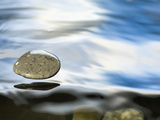 Skipping Stone Just About to Hit the Water's Surface Photographic Print by Michael Durham/Minden Pictures