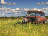 A 1950 Chevrolet Styleline Deluxe 4-Door Sedan Sits Idle in a Field Photographic Print by Pete Ryan
