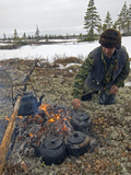 A Komi Reindeer Herder Makes Tea During Reindeer Calving Season Photographic Print by Gordon Wiltsie