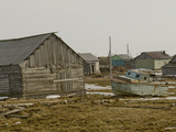 An Old Boat Sits Amongst Sheds and Houses in Snopa Village Photographie par Gordon Wiltsie