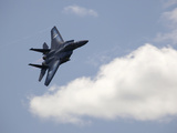 A Fighter Jet Soars Through the Clouds on a Clear Day Photographic Print by Pete Ryan