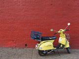 A Yellow Motor Scooter Against a Red Wall in Little Five Points Photographic Print by Krista Rossow