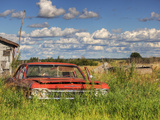 An Abandoned Red Car from the 1970S Sits in a Field Photographic Print by Pete Ryan
