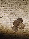 Spanish Coins Lie on a Slavery Bill of Sale Photographic Print by Maggie Steber