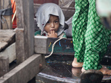 Portrait of a Child on a Boat at Tonle Sap, Cambodia Photographic Print by Kent Kobersteen