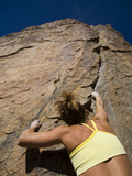 A Female Rock Climber in Joshua Tree National Park, California Photographic Print by John Burcham