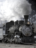 A Steam Train Puffing Smoke While Moving Down Tracks Photographic Print by Robbie George