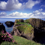 Crossing Carrick-A-Rede Rope Bridge on the North Antrim Coast Photographic Print by Chris Hill