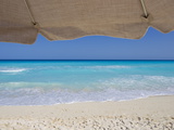 View of Turquoise Waters from Underneath a Beach Umbrella Photographic Print by Mike Theiss
