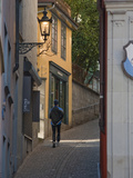 A Jogger Runs Up an Alley in Zurich's Old Town Photographie par Greg Dale