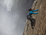 A Climber, Without a Rope, Jams Her Hands into Fissures for Ascent Photographic Print by Mikey Schaefer