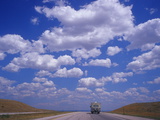 Clouds in a Vast Sky Above a Highway in Montana Photographic Print by Aaron Huey
