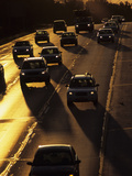 Cars Silhouetted on I-94 Interstate at Sunset Photographie par Paul Damien