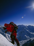 A Climber Ascends a Steep Section of Ice on Nanga Parbat's Slopes Photographic Print by Tommy Heinrich