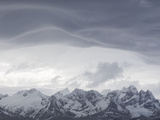 Snow-Capped Mountain Range with Threatening Clouds Overhead Photographic Print by Roy Toft