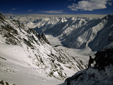 A Climber Takes a Short Rest During the Ascent to Nanga Parbat's Camp Photographic Print by Tommy Heinrich