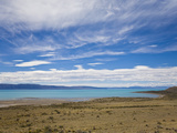 Lake Argentina with Desert Shoreline and Mountains in the Distance Photographic Print by Mike Theiss