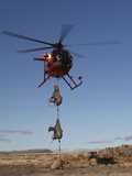 A Spotter Watches as the Pilot Sets Down the First Load of Sheep Photographic Print by Drew Rush