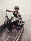 A Boy Proudly Displays His Catch of Spotted Channel Catfish Photographic Print by J. Baylor Roberts