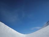 An Extreme Trekker Skis over an Unnamed Pass Photographic Print by Michael Christopher Brown