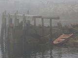 Rowboat in the Rocks and a Pier in Early Morning Fog Photographie par Anne Keiser