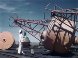 A Naval Officer Inspects a Buoy Impressão fotográfica por Luis Marden