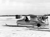 A Game Warden's Snowmobile Skims over Thin Ice on Lake Minnetonka Photographie par Thomas J. Abercrombie