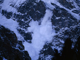 An Avalanche Rumbles Down the Steep Slopes of Nanga Parbat Photographic Print by Tommy Heinrich