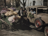 A Woman in a Car Buys Flowers from a Street Vendor in Dupont Circle Photographie par Edwin L. Wisherd