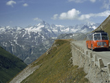 A Tourist Bus Drives Up a Very Narrow Road over a 7,976-Ft. Pass Photographic Print by Franc & Jean Shor