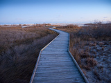 A Wooden Walkway across Marshland Toward the Ocean Photographic Print by Karen Kasmauski