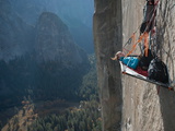 A Climber Reclines on a Hanging Camp on El Capitan Photographie par Jimmy Chin