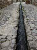 An Ancient Inca Stone Street with a Water Sluice Running Through It Photographic Print by Kent Kobersteen