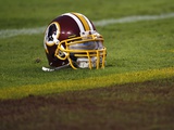 Patriots Redskins Football: Landover, MD - A Washington Redskins Helmet Photographic Print by Pablo Martinez Monsivais