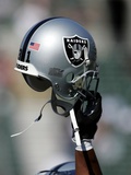 49ERS RAIDERS FOOTBALL: OAKLAND, CALIFORNIA - An Oakland Raiders Helmet Photographic Print by Marcio Jose Sanchez