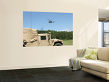 A Uh-1N Helicopter Flies over the Marine Air Support Squadron Compound Mural por Stocktrek Images A Uh-1N Helicopter Flies over the Marine Air Support Squadron Compound Mural por Stocktrek Images