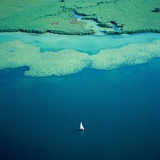 Sailing boat on lake, Bavaria, Germany Photographic Print by Klaus Leidorf