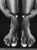 Man holding ankles Photographic Print by Nikos 