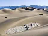 Cracked Rock Formation Amongst Sand Dunes Photographic Print by Kennan Ward